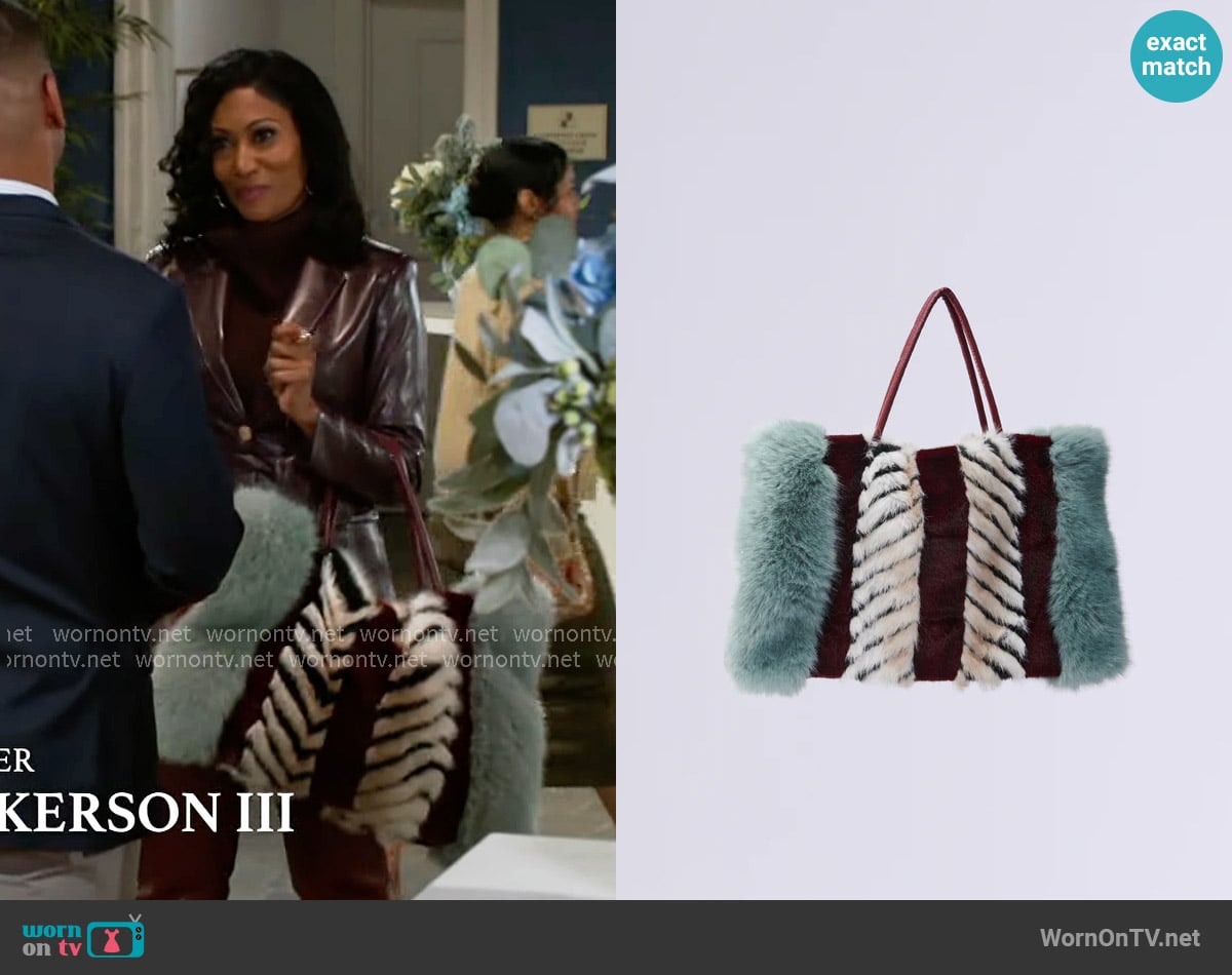 Akira Have It All Faux Fur Tote worn by Dana 'Leslie' Thomas (Trisha Mann-Grant) on Beyond the Gates