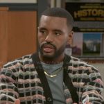 Andre’s checked cardigan on Beyond the Gates