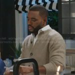 Andre’s beige cardigan on Beyond the Gates