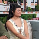 Anissa Borrego’s yellow embellished bow dress on Access Hollywood