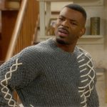 Bernard’s gray contrast stitch sweater on The Upshaws