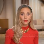Dorit’s red mock neck confessional top on The Real Housewives of Beverly Hills