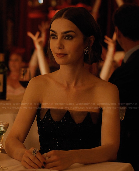 Emily’s embellished earrings and rings on Emily in Paris