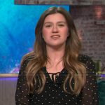 Kelly’s black polka dot sheer blouse on The Kelly Clarkson Show