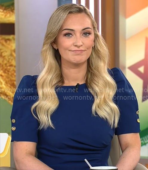 Kelly O’Grady’s dark blue puff-sleeve dress on CBS Mornings