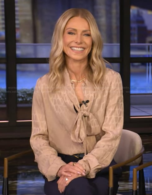 Kelly’s beige tie neck blouse on Live with Kelly and Mark