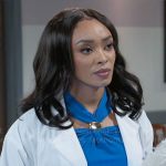Madison’s blue top with gold detail on Beyond the Gates