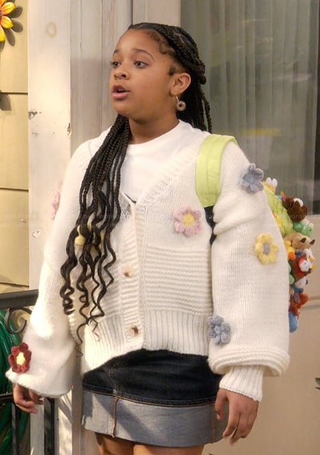 Maya’s white floral knit cardigan on The Upshaws