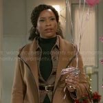 Naomi’s tan coat with black leather trims on Beyond the Gates
