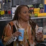 Regina’s abstract print wrap blouse on The Upshaws
