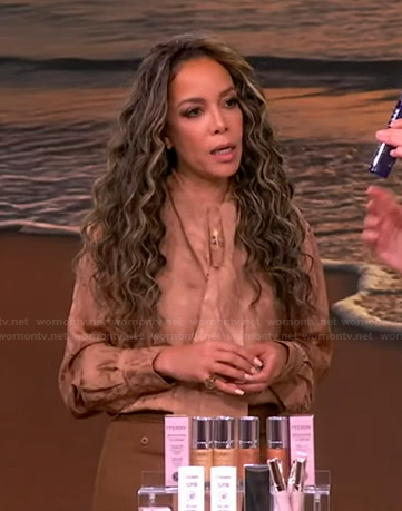 Sunny’s beige satin tie neck blouse on The View