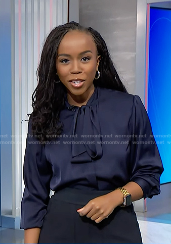 Zinhle’s navy tie neck blouse on NBC News Daily