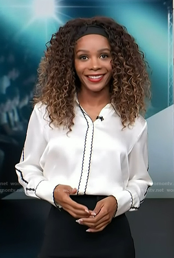 Zuri’s white scalloped trim shirt on Access Hollywood