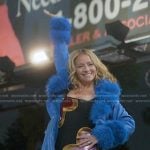 Loran’s black heart print dress and blue feather trim trench coat on The Lincoln Lawyer