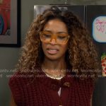 Courtney’s burgundy sweater vest with gold buttons on The Neighborhood