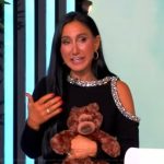 Elizabeth Werner’s black embellished cold shoulder top on The View