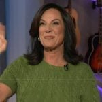 Emily Kaufman’s green cable knit sweater on The Kelly Clarkson Show