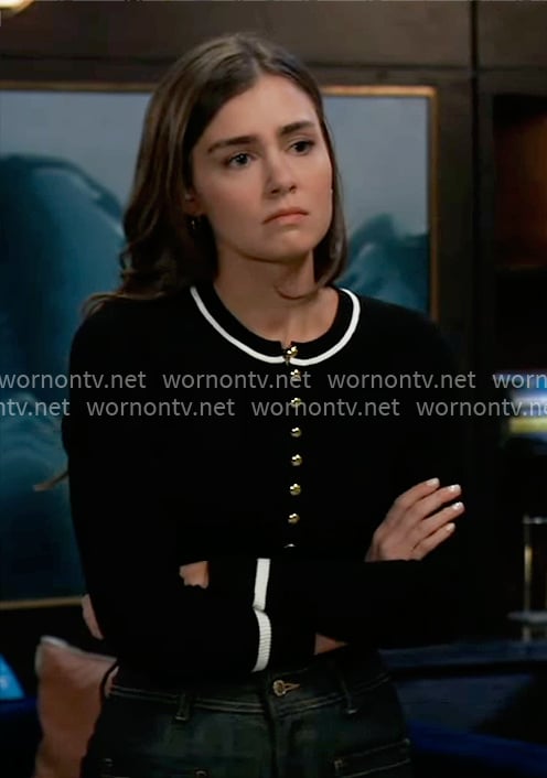 Emma’s black top with gold buttons and white stripe trim on General Hospital
