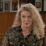 Jan’s black floral top on Beyond the Gates