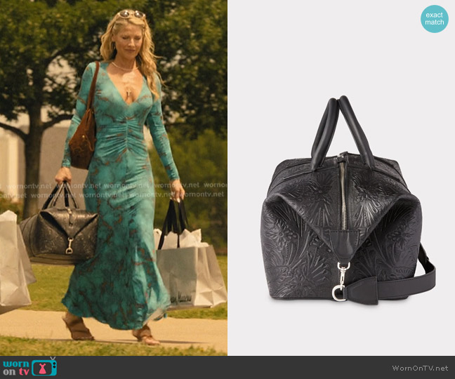 Lucchese Hand-Tooled Duffle worn by Angela Norris (Ali Larter) on Landman