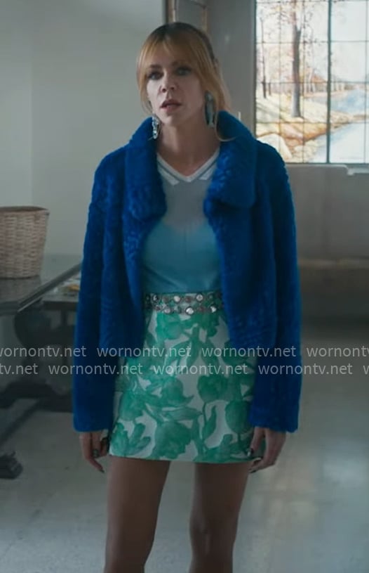 Morgan’s blue fur jacket, green printed mini skirt, and fish earrings on High Potential