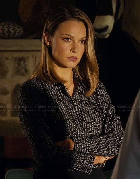 Rebecca’s black chain link print blouse on Landman