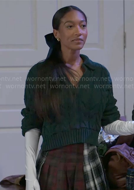 Samantha’s green cable knit sweater and plaid skirt on Beyond the Gates