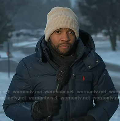 Shaquille Brewster’s navy down jacket on NBC News Daily