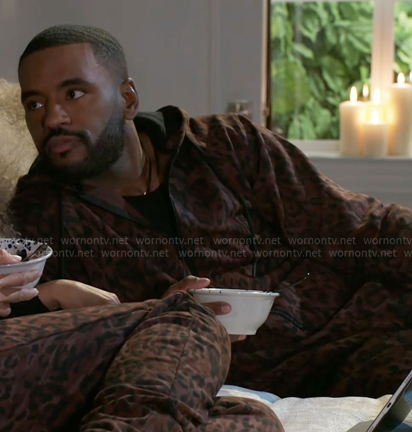 Andre’s leopard print onesie on Beyond the Gates