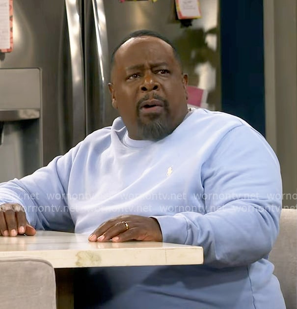 Calvin’s light blue sweatshirt on The Neighborhood