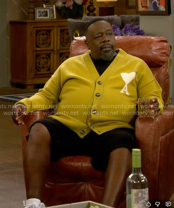 Calvin’s mustard yellow cardigan with heart on The Neighborhood