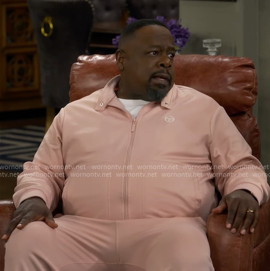 Calvin’s pink track jacket and pants set on The Neighborhood