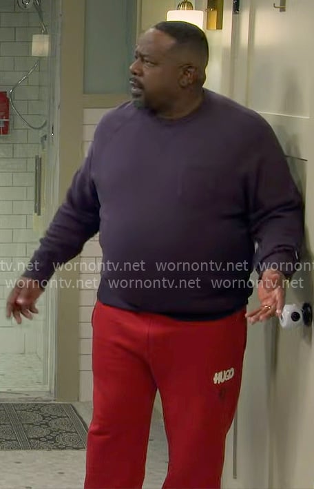 Calvin’s red HUGO sweatpants on The Neighborhood