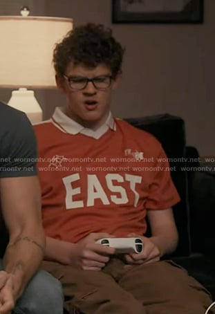 Christopher’s red EAST print tee on 9-1-1