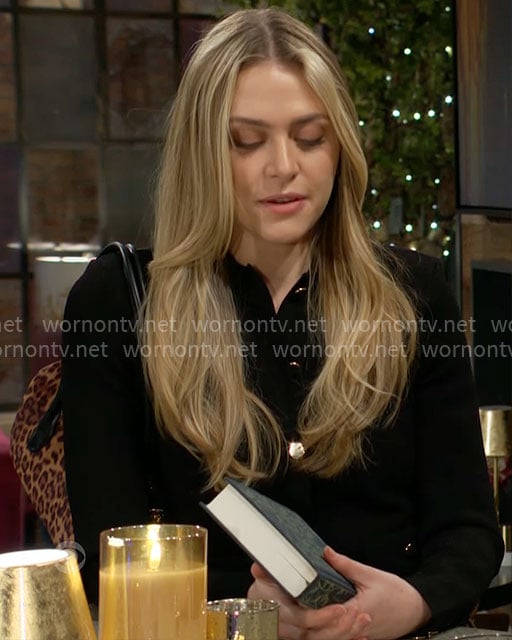 Claire’s black top with gold buttons and leopard bag on The Young and the Restless