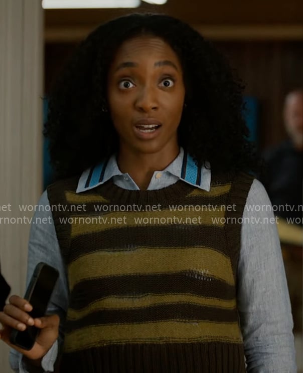 Faith’s olive striped sweater vest and blue shirt on Will Trent