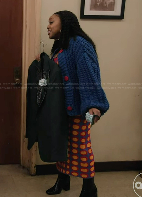 Janine’s printed dress and chunky blue cardigan on Abbott Elementary