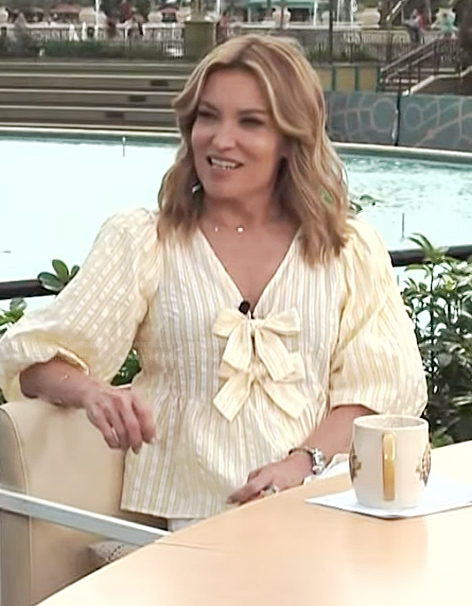 Kit’s yellow stripe bow detail top on Access Hollywood
