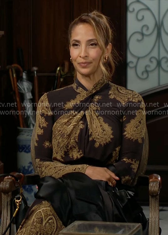 Lily’s black and gold printed cross-neck dress on The Young and the Restless