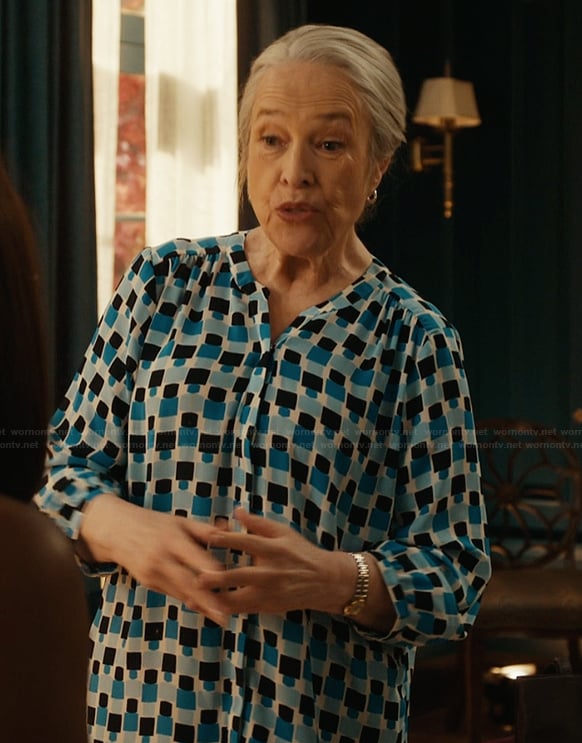 Madeline’s blue geometric print top on Matlock