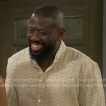 Malcolm’s beige striped shirt on The Neighborhood