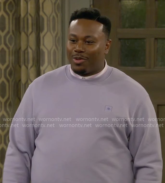Marty’s lavender purple sweatshirt on The Neighborhood