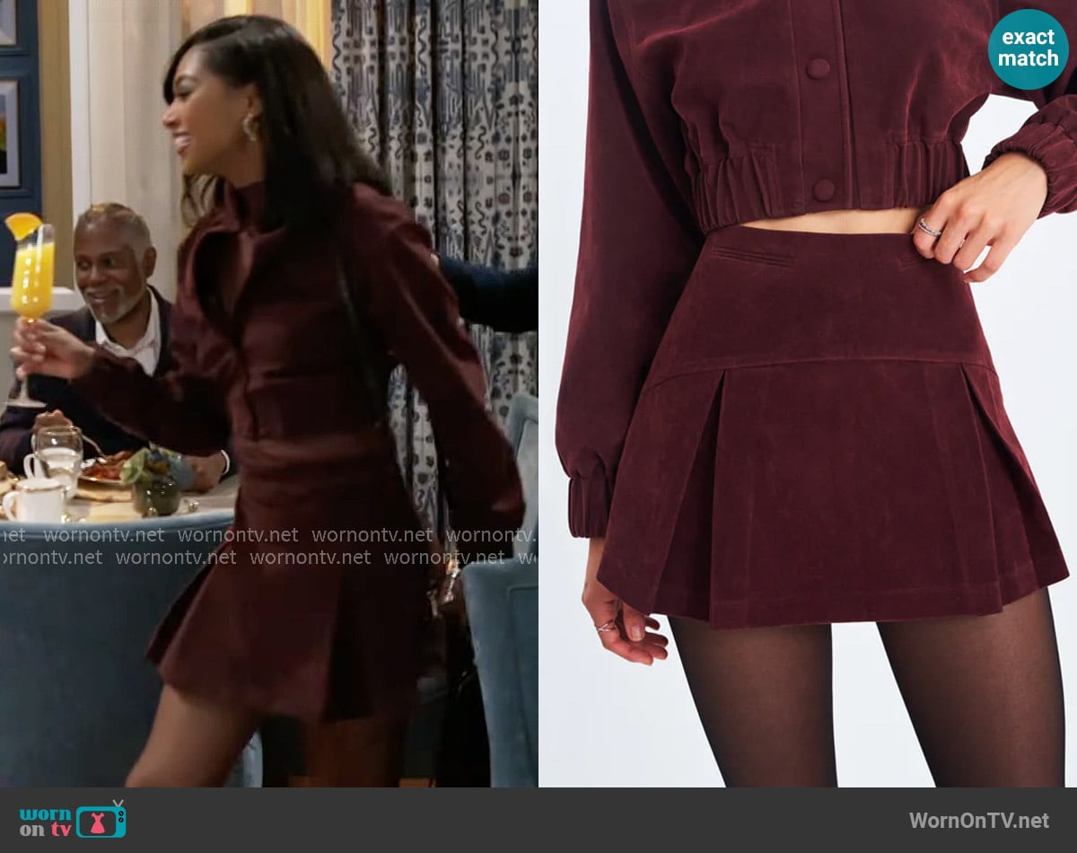 Miss Circle Faryn Mahogany Vegan Suede Pleated A-Line Mini Skirt worn by Kat Richardson (Colby Muhammad) on Beyond the Gates