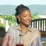 Halle Bailey’s mixed stripe balloon sleeve dress on Access Hollywood