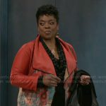 Mona’s red floral jacket on Beyond the Gates