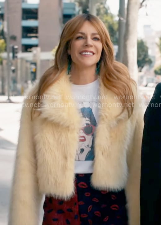 Morgan’s graphic tee and yellow fur jacket on High Potential