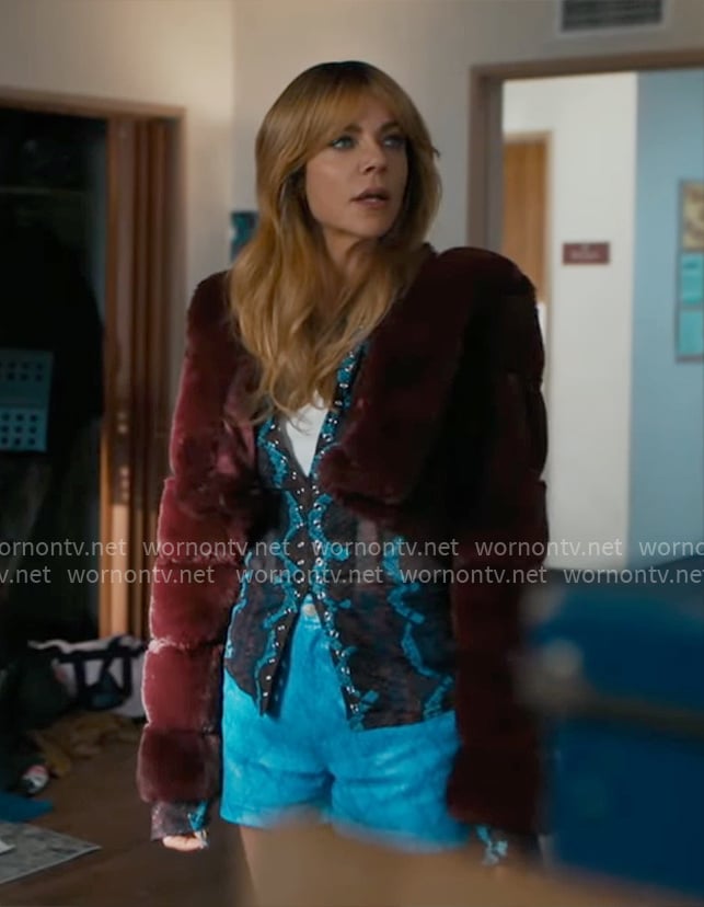 Morgan’s snake print mesh top, burgundy fur jacket and blue shorts on High Potential