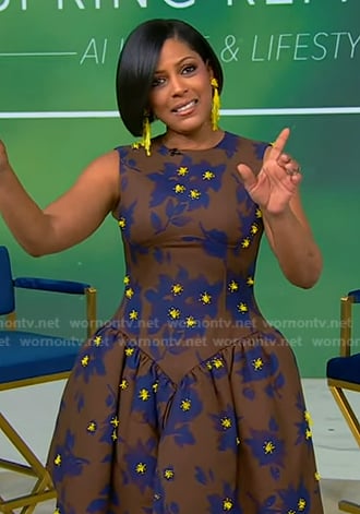 Tamron’s brown floral asymmetric dress on Tamron Hall Show