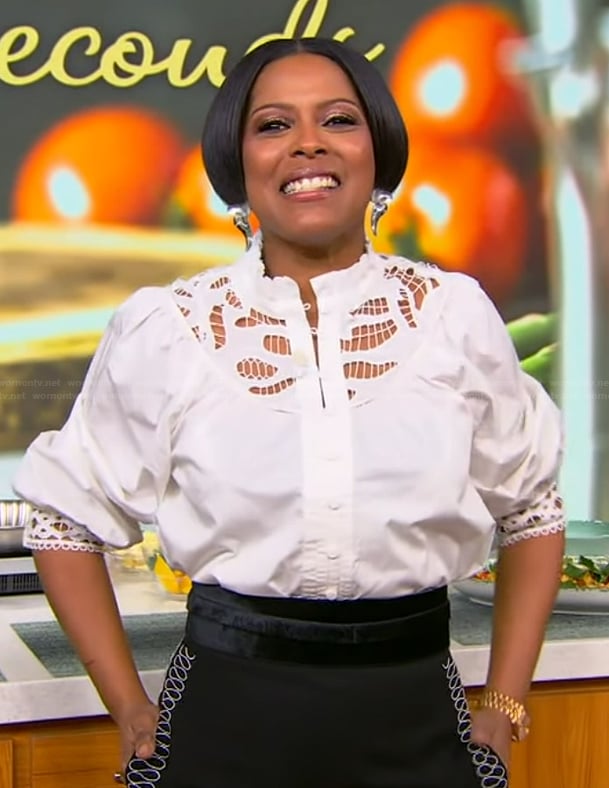 Tamron’s white lace top and pants on Tamron Hall Show