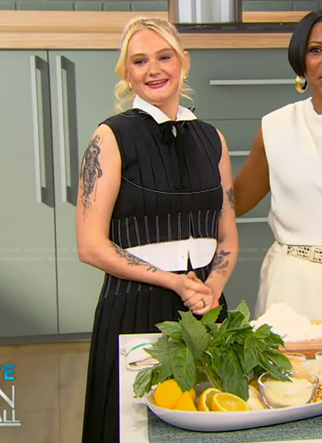 Tini Younger’s black pleated top and skirt on Tamron Hall Show